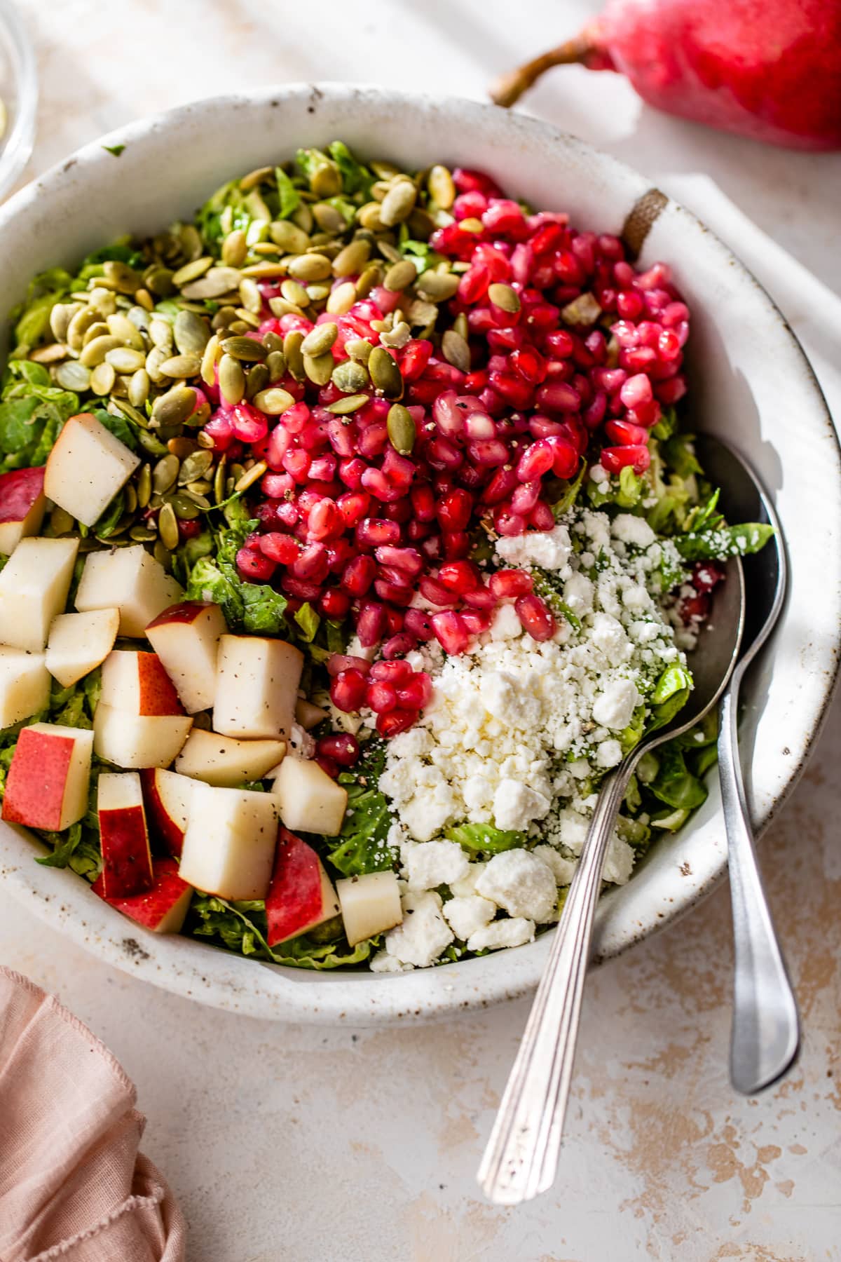 Shaved Brussels Sprouts Salad with Pear, Pomegranate and Pepitas