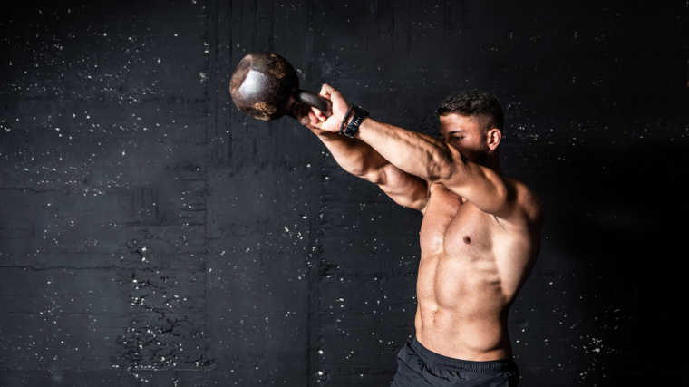 A person is doing a kettlebell exercise